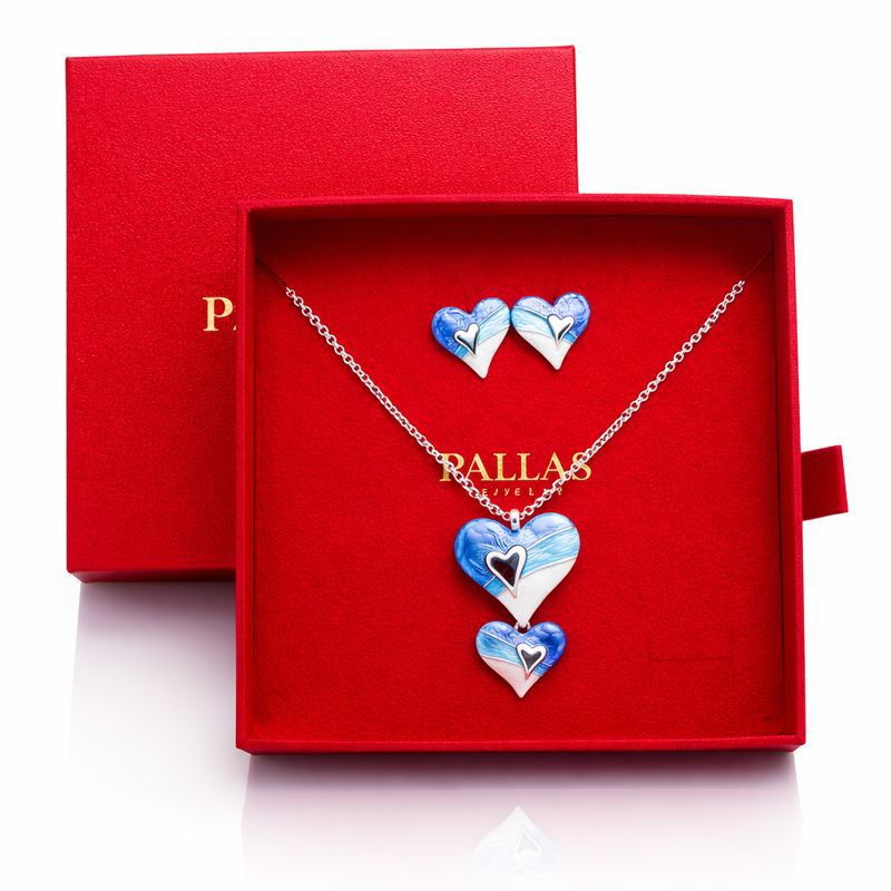 Romantic KC gold heart necklace and earrings set with reflection on white background