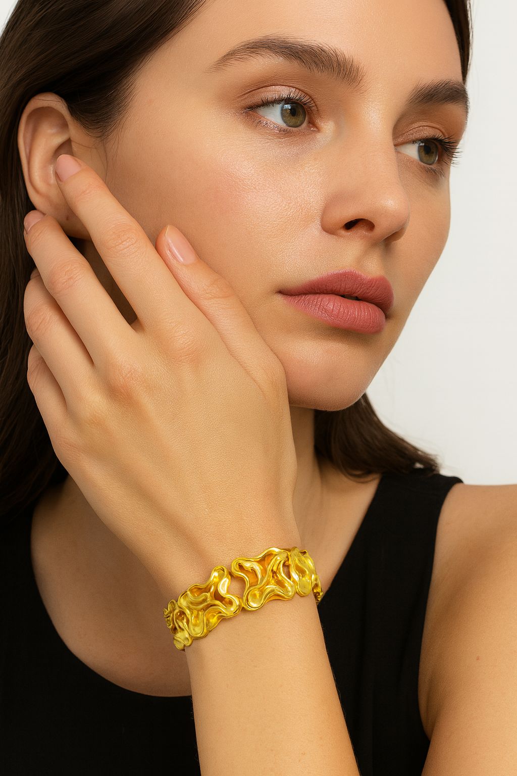 Hand-painted gold bangle with glossy texture”