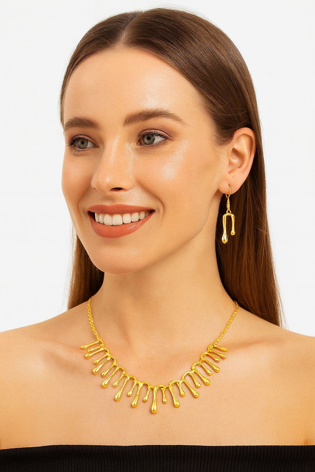 Sculptural droplet-style gold jewelry set with artistic finish