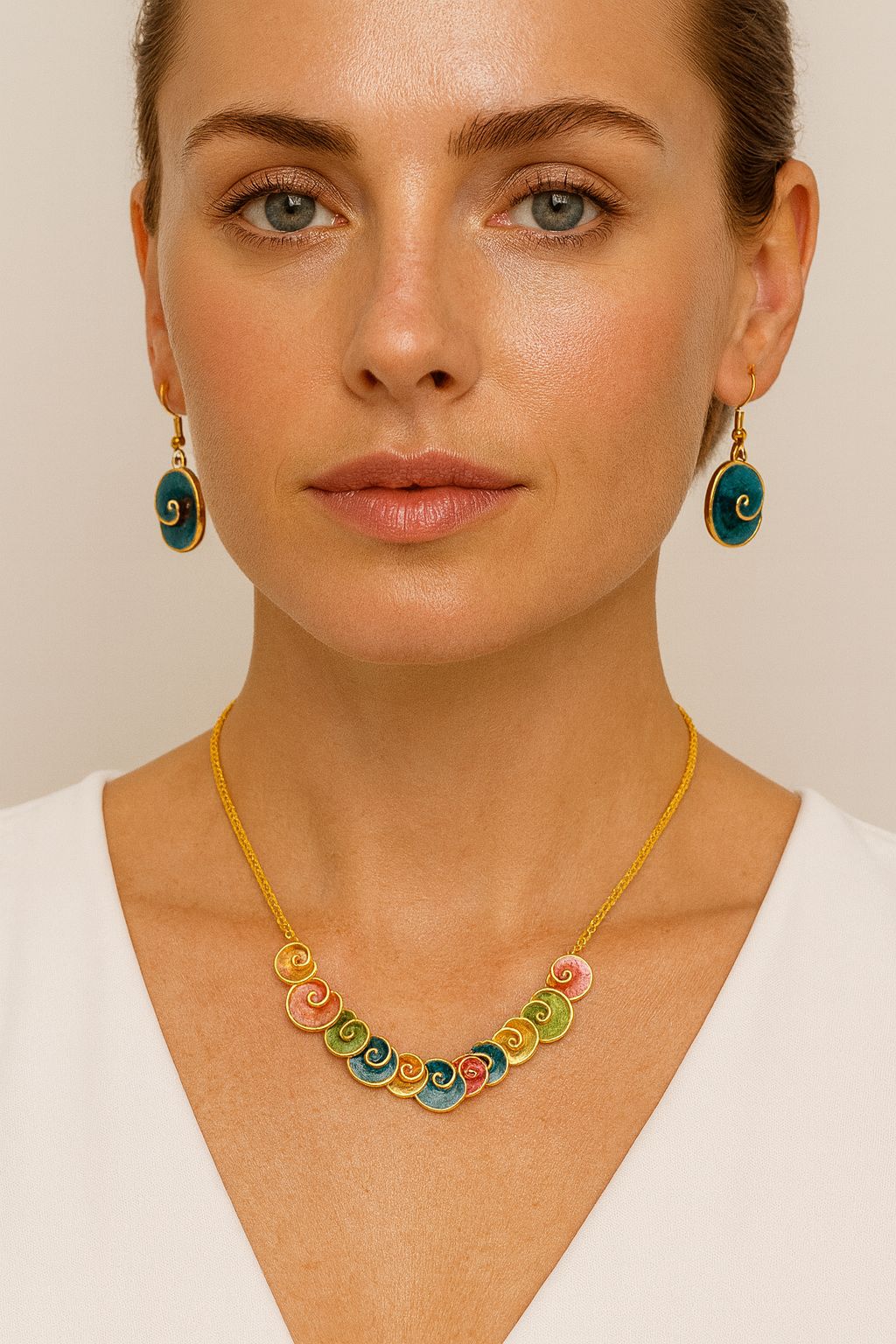 Close-up of spiral enamel earrings with KC gold plating