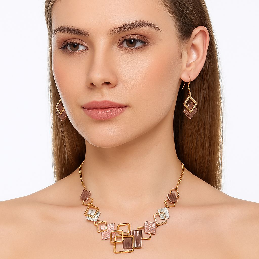 Interlocking square necklace and earrings worn by model