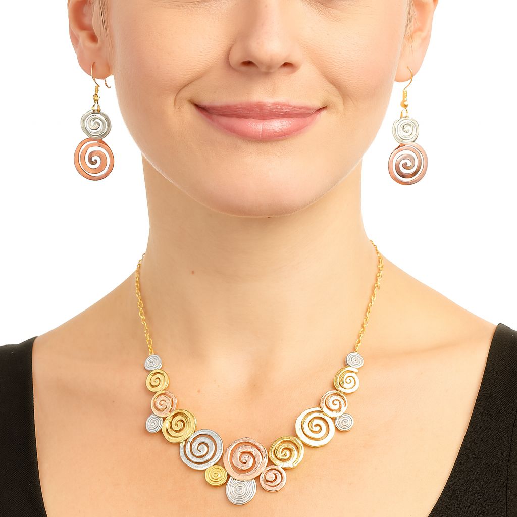 KC gold plated spiral necklace with handcrafted enamel details