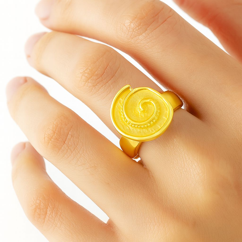 Woman wearing golden swirl petal ring on hand