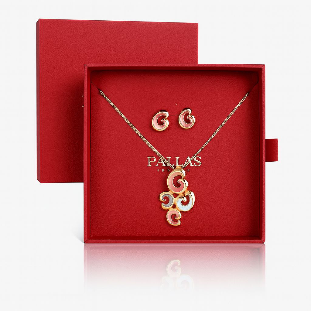 KC gold plated swirl necklace and earrings set in red gift box
