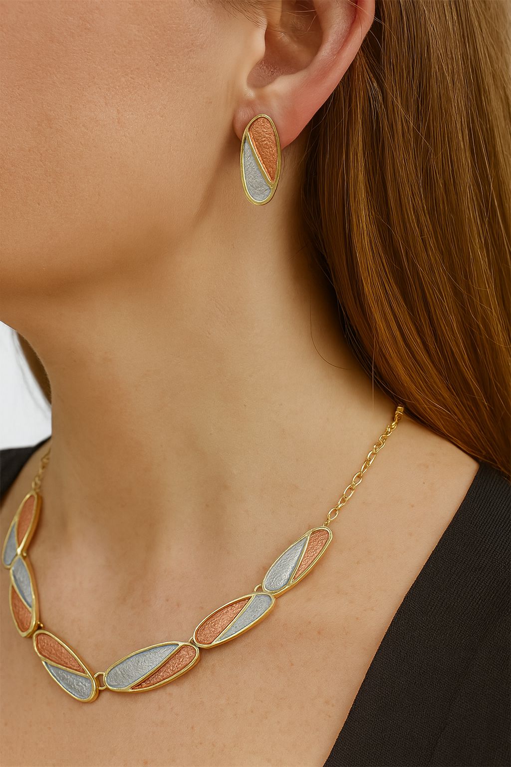 Close-up view of KC gold plated oval earrings