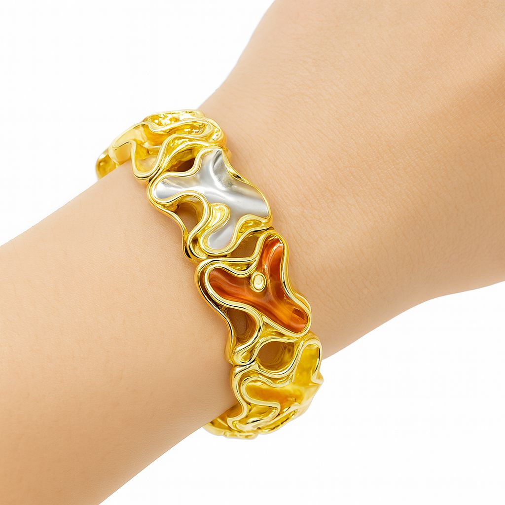 Model wearing hand-painted abstract KC gold bracelet