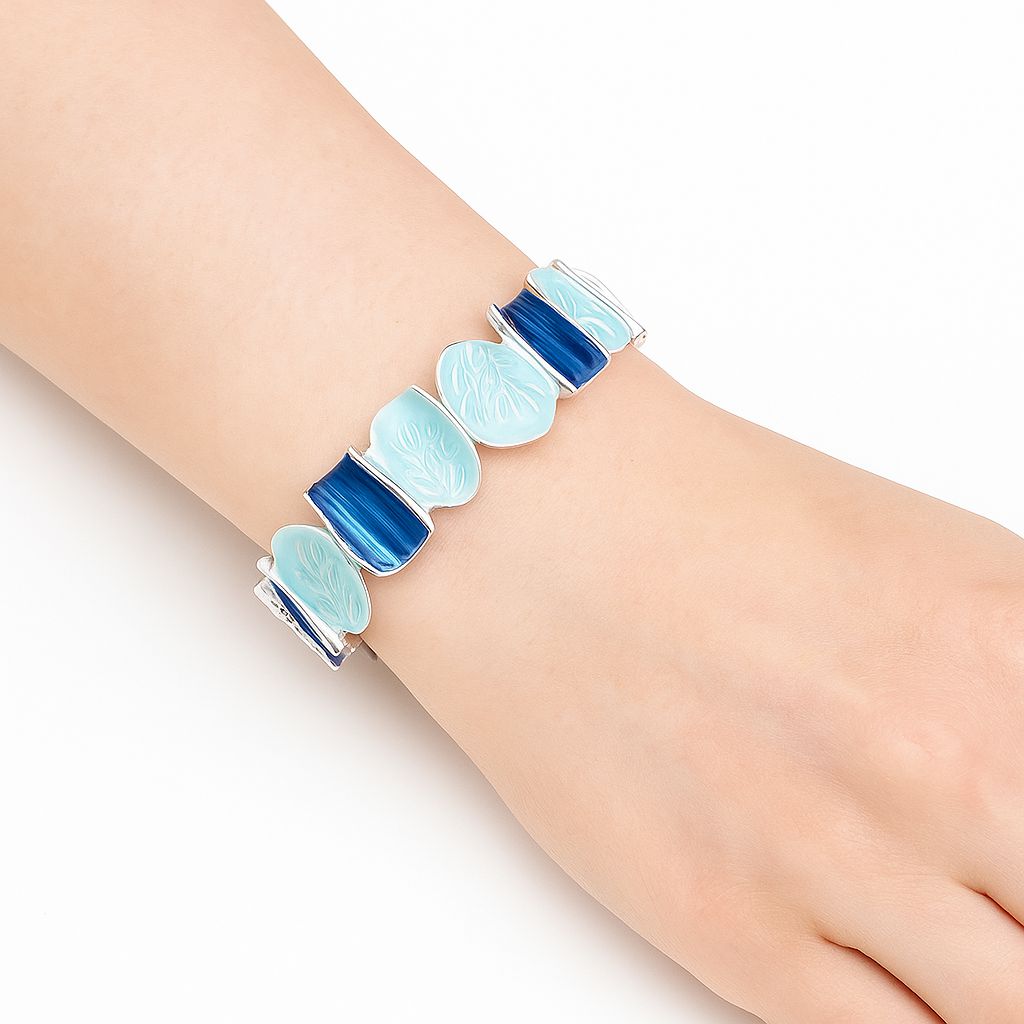 Fashion enamel bracelet shown on model’s wrist in blue tones