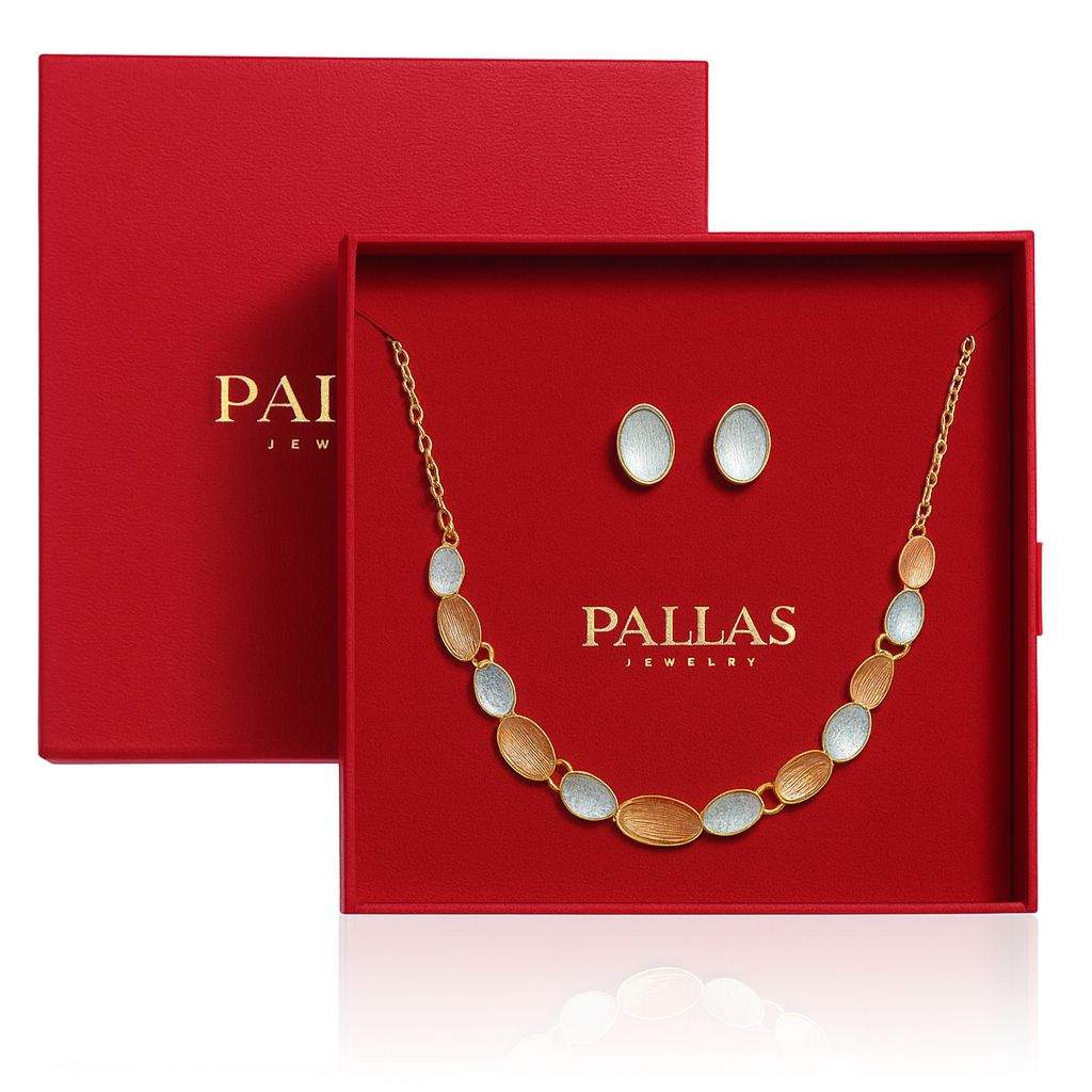 Gold oval necklace and earrings set with multi-tone brushed textures in luxury red gift box