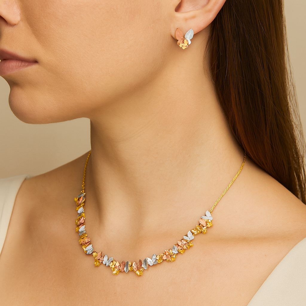 lose-up of butterfly earrings with hand-painted enamel petals