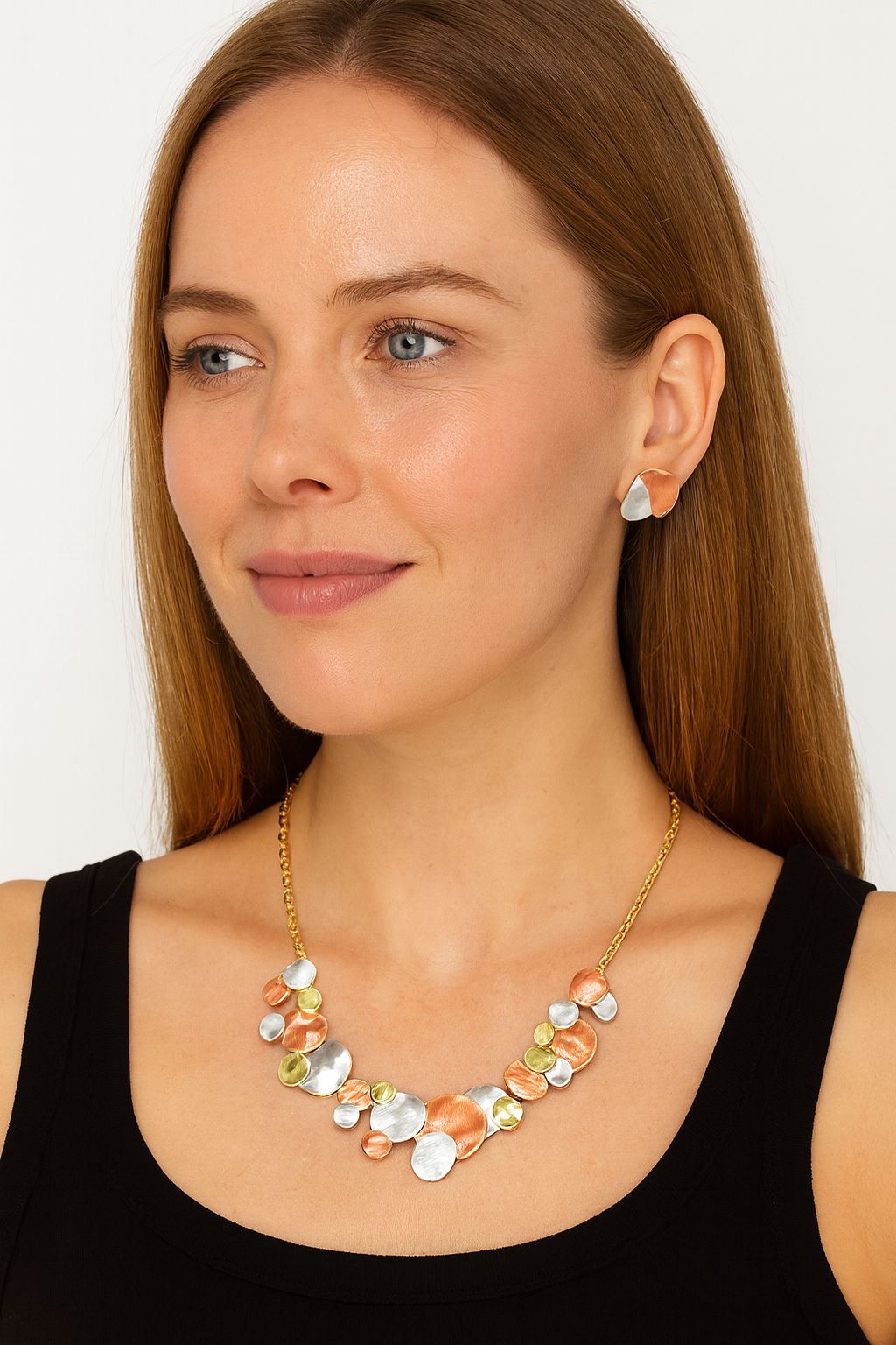 Model wearing artistic alloy necklace and matching earrings”