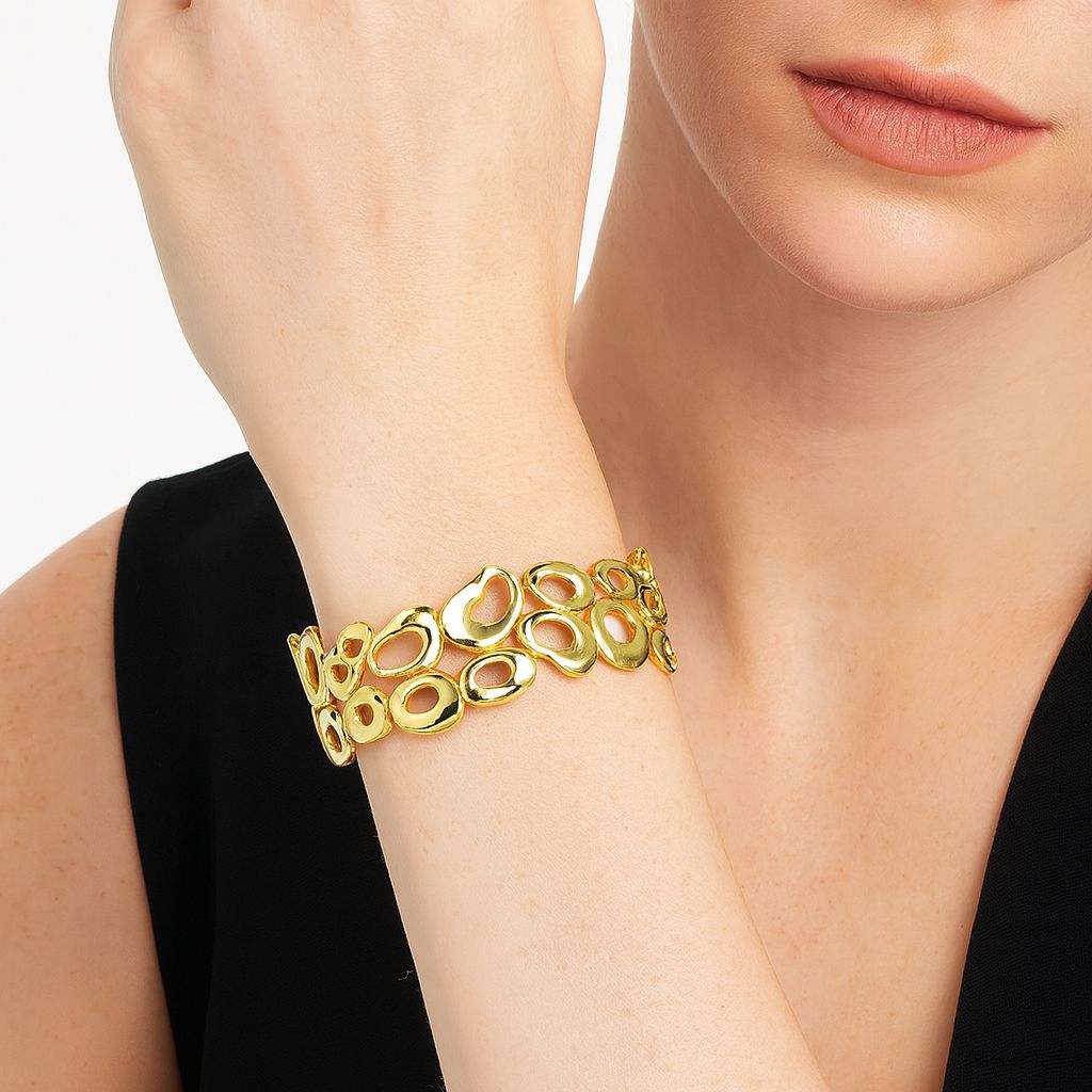 KC Gold Openwork Oval Bracelet on wrist showcasing textured gold openwork oval links and modern design