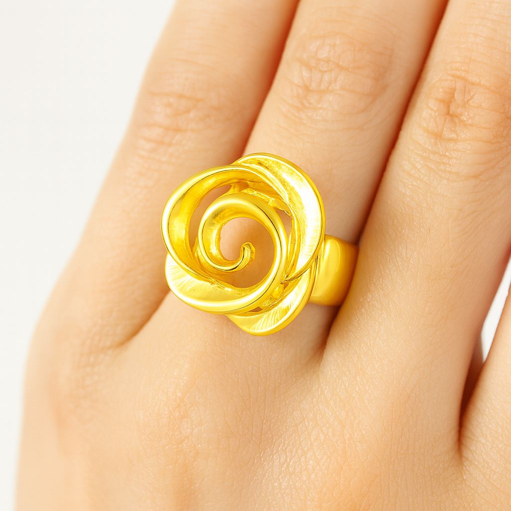 Woman wearing sculptural gold rose ring on finger