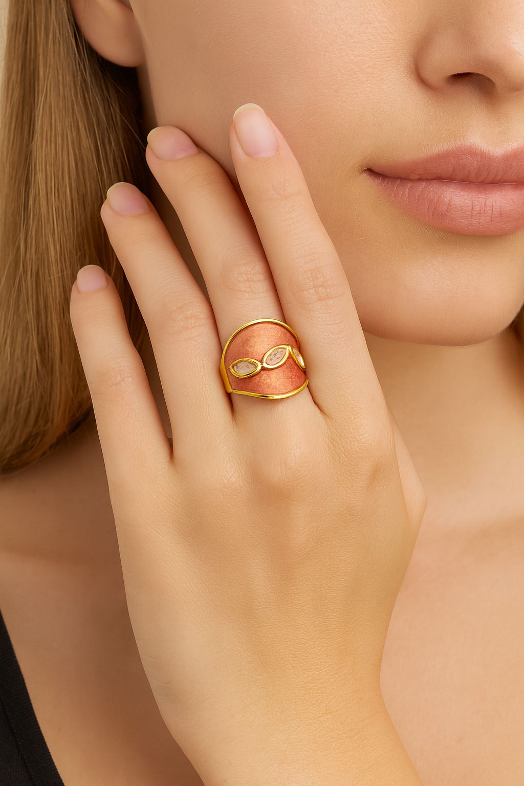 Woman wearing adjustable gold enamel statement ring