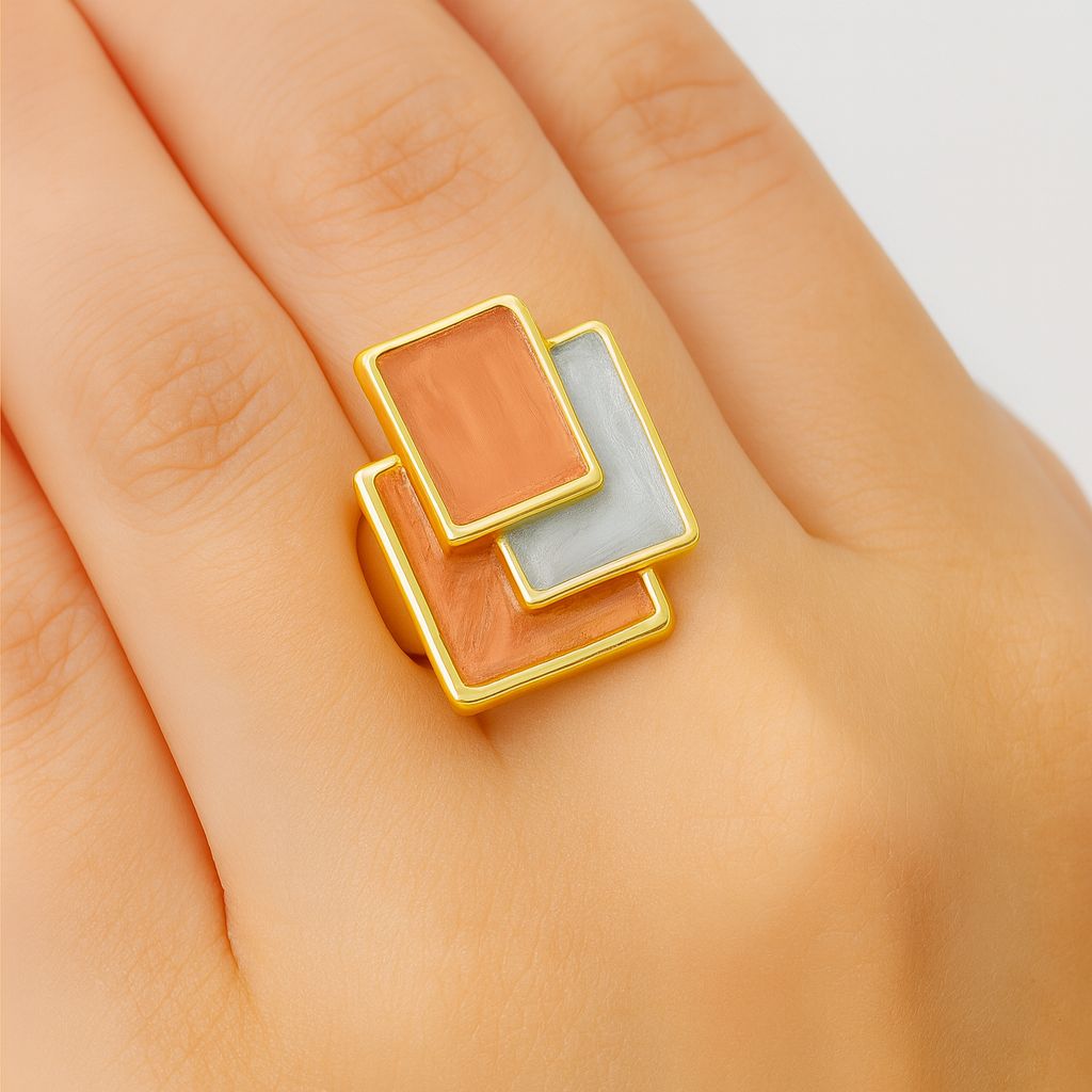 Woman wearing geometric hand-painted square statement ring in KC gold.