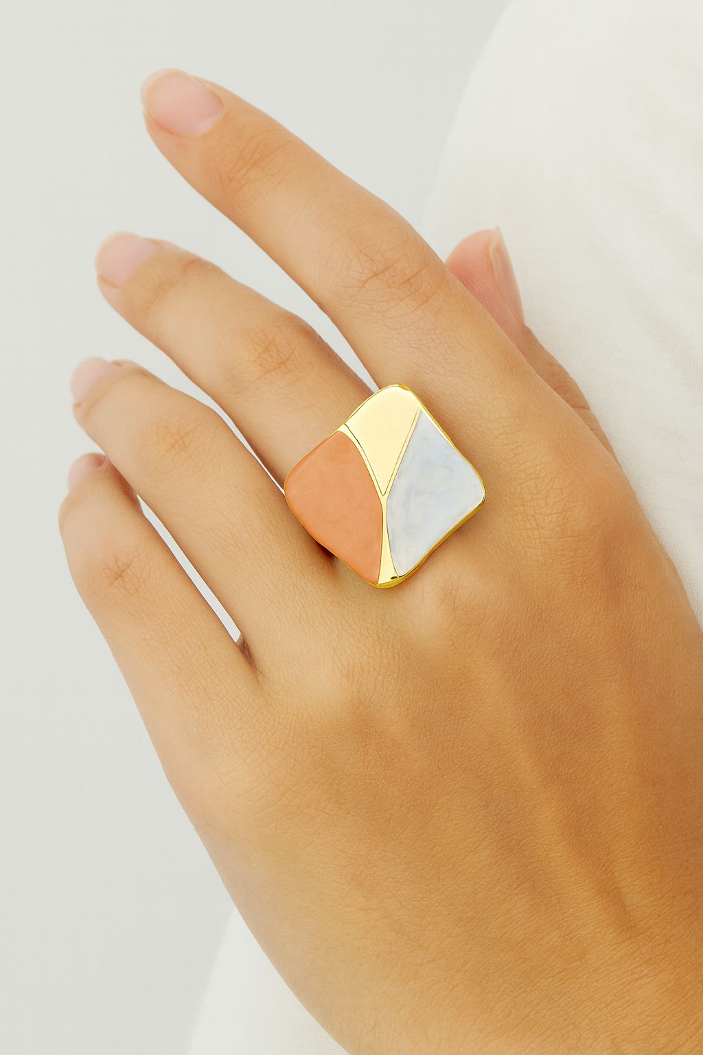 Woman wearing KC gold geometric enamel ring in modern fashion style