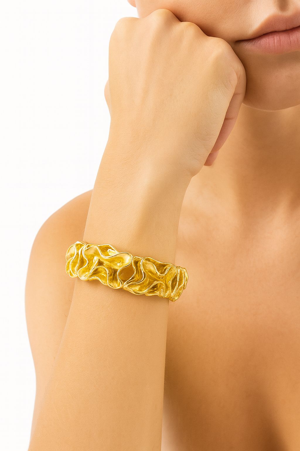 Woman wearing KC gold fluid design bracelet