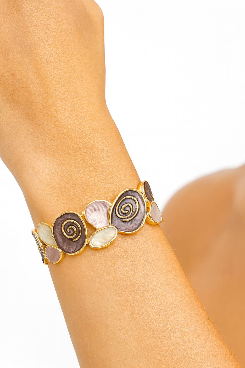 Model wearing hand-painted enamel heart charm bracelet