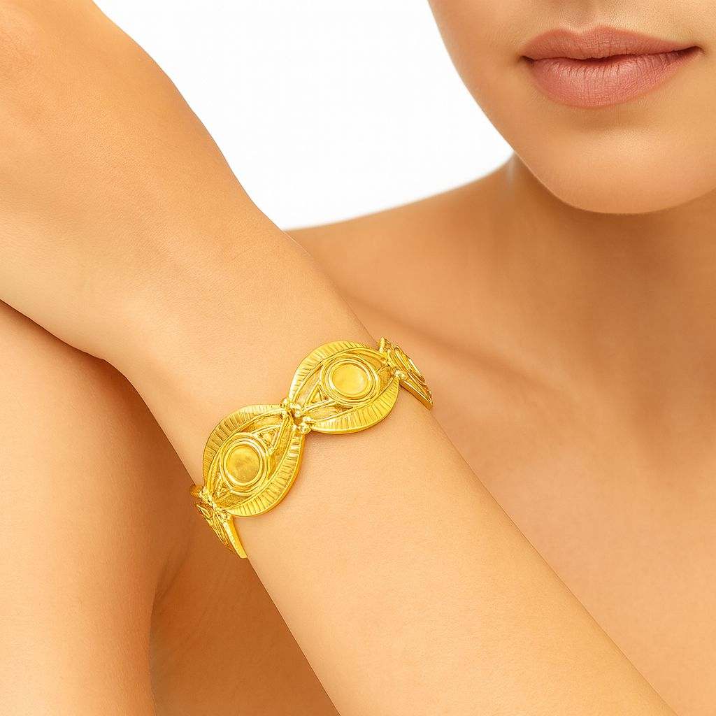 Model wearing KC gold oval relief bracelet for elegant styling