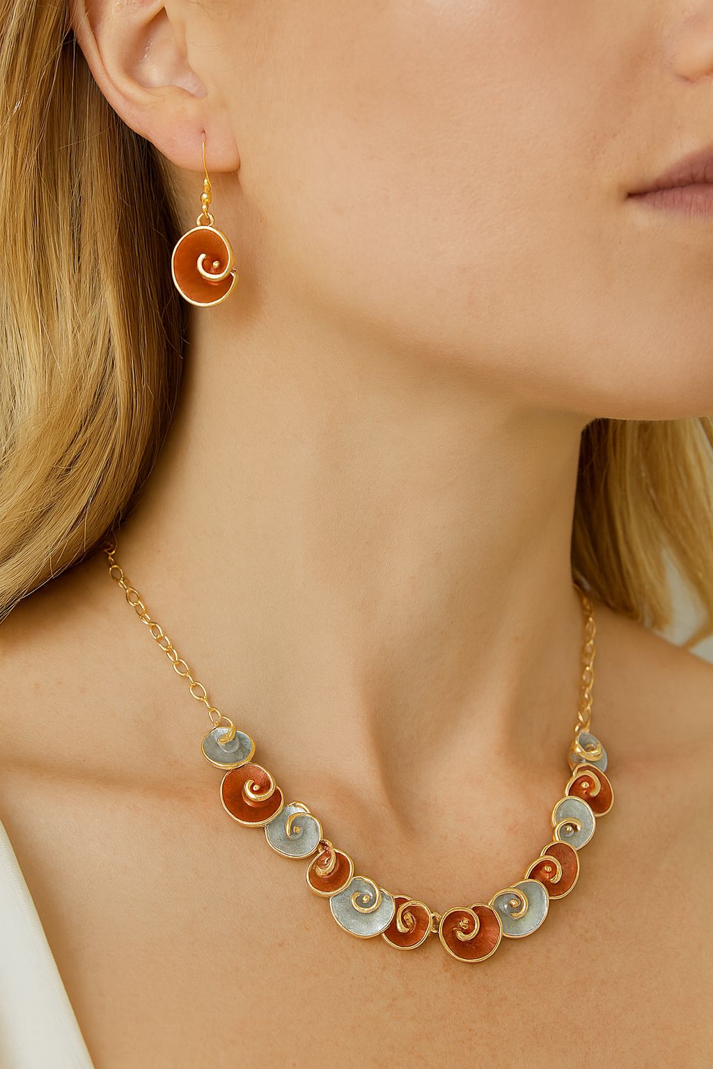 Close-up of spiral enamel drop earrings for women