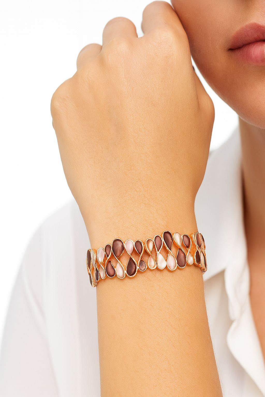 Woman wearing brown and nude enamel fashion bracelet