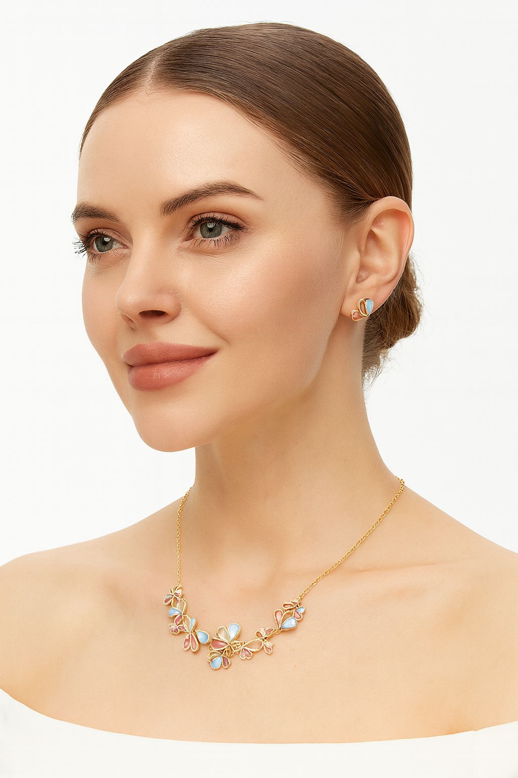 Model wearing floral petal necklace and stud earrings in KC gold