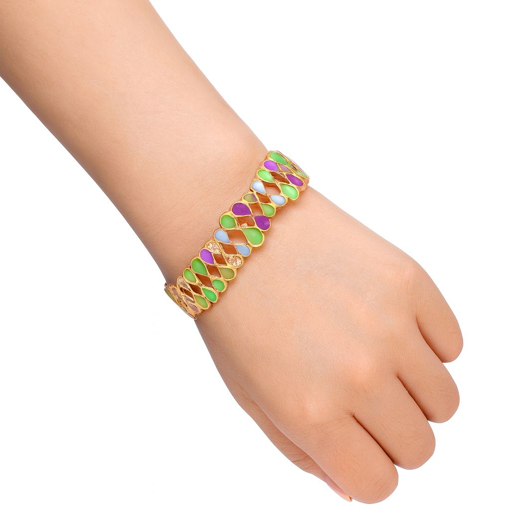 Woman wearing red and cream enamel statement bracelet