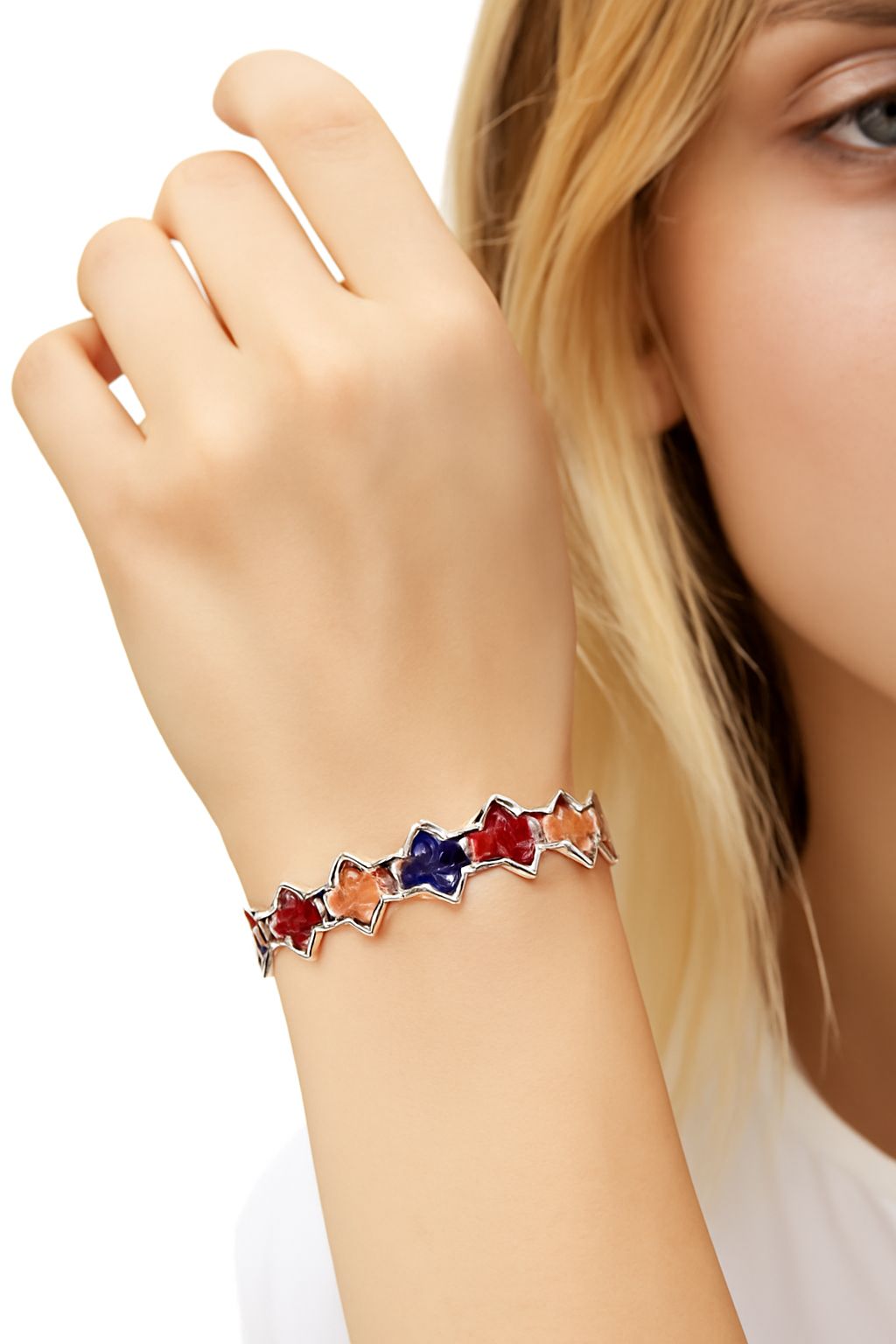 Model wearing vibrant star bracelet, handmade enamel jewelry gift